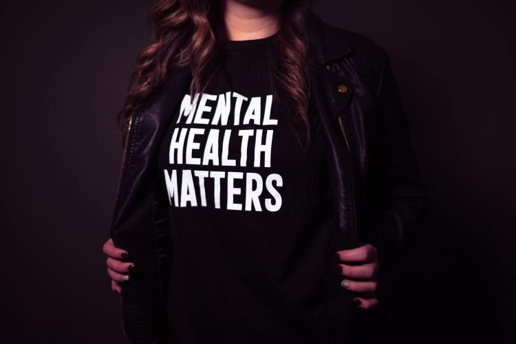 Person in a mental health matters shirt