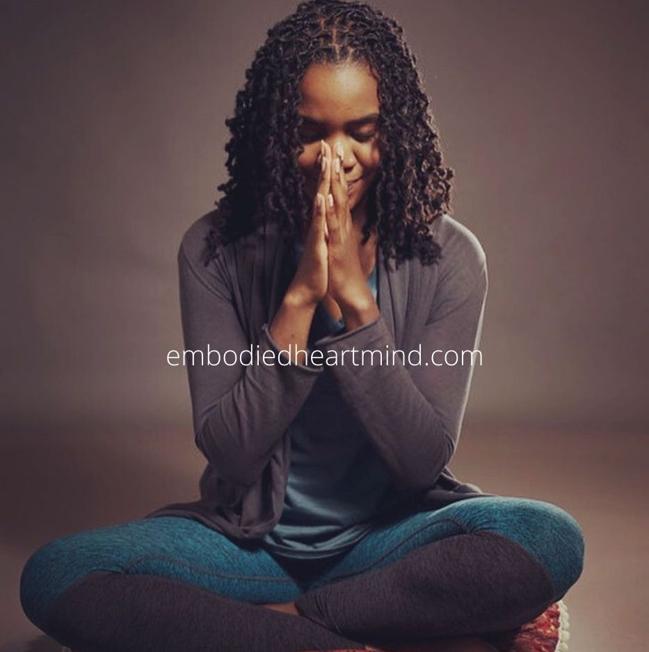 Photo of person seated bowing
